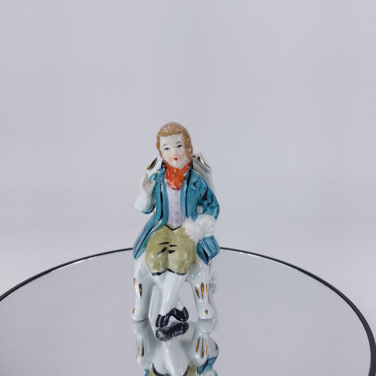 Vintage Porcelain Figurine, Man Seated in Chair, Teal Jacket and Orange Scarf