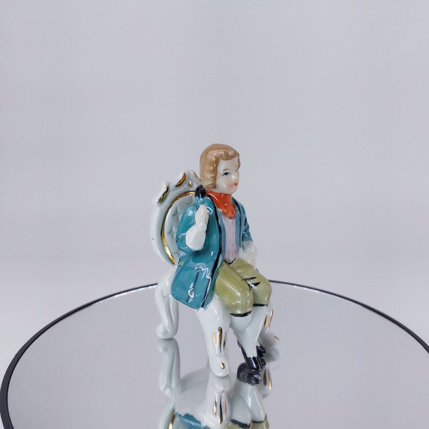 Vintage Porcelain Figurine, Man Seated in Chair, Teal Jacket and Orange Scarf