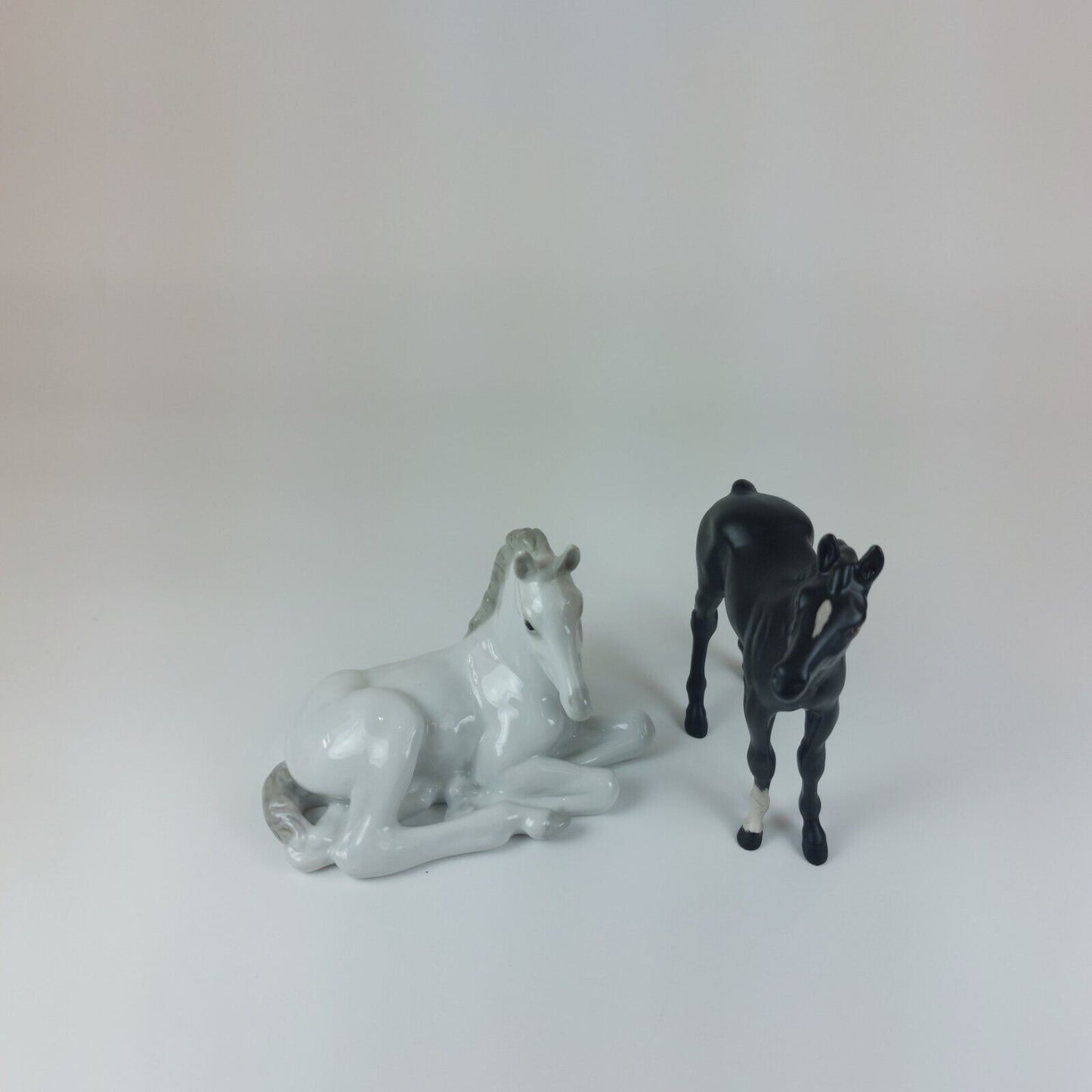 White Horse Recumbent Lomonosov Porcelain - USSR & Black Horse Figurine Beswick