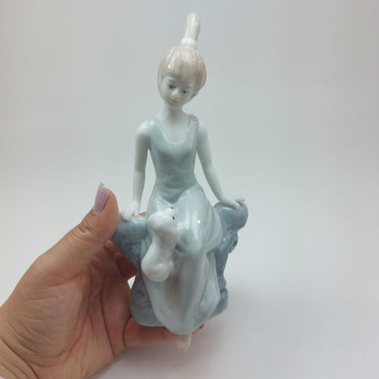 Fine Porcelain Figurine - Lady Sitting with Dog, Handcrafted Glaze