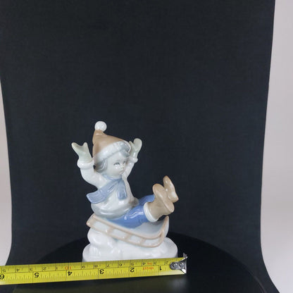 Vintage Germany-Made Porcelain Kid on Sled Figurine, Good Condition, 12cm