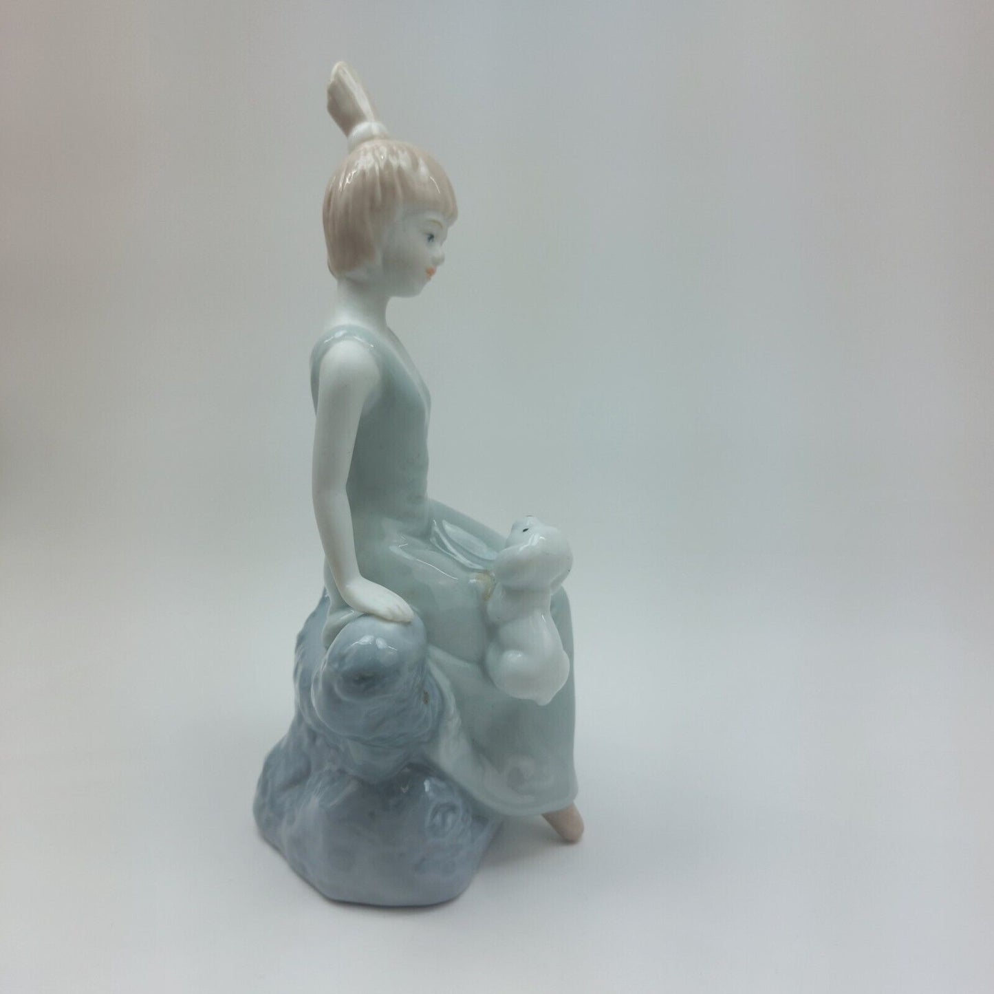 Fine Porcelain Figurine - Lady Sitting with Dog, Handcrafted Glaze