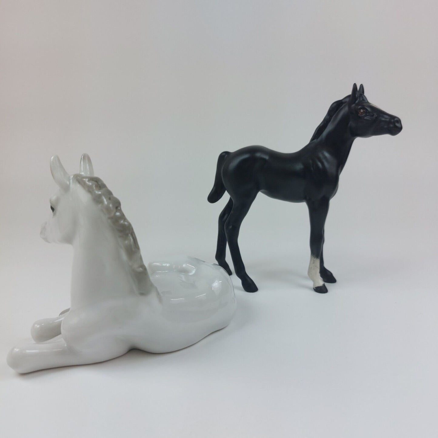 White Horse Recumbent Lomonosov Porcelain - USSR & Black Horse Figurine Beswick