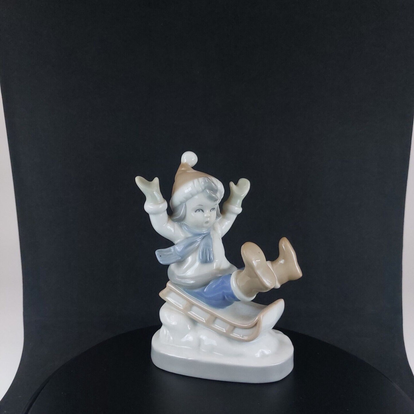 Vintage Germany-Made Porcelain Kid on Sled Figurine, Good Condition, 12cm