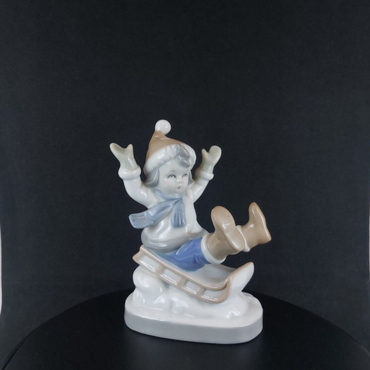 Vintage Germany-Made Porcelain Kid on Sled Figurine, Good Condition, 12cm